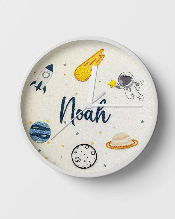 Children's wall clock with space-themed design