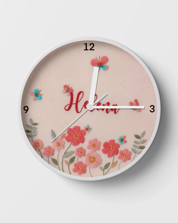 Wall clock with floral design and the name