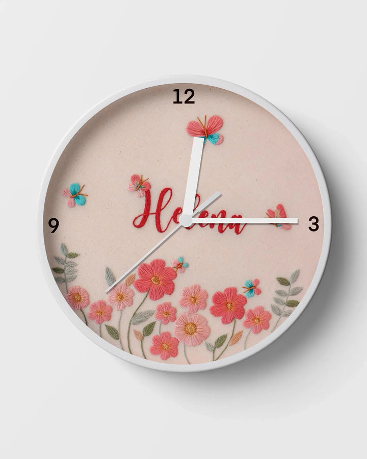 Wall clock with floral design and the name