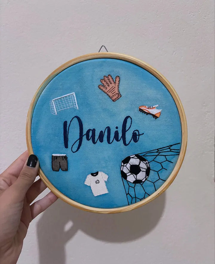 Custom football nursery decor showing detailed football gear embroidery work
