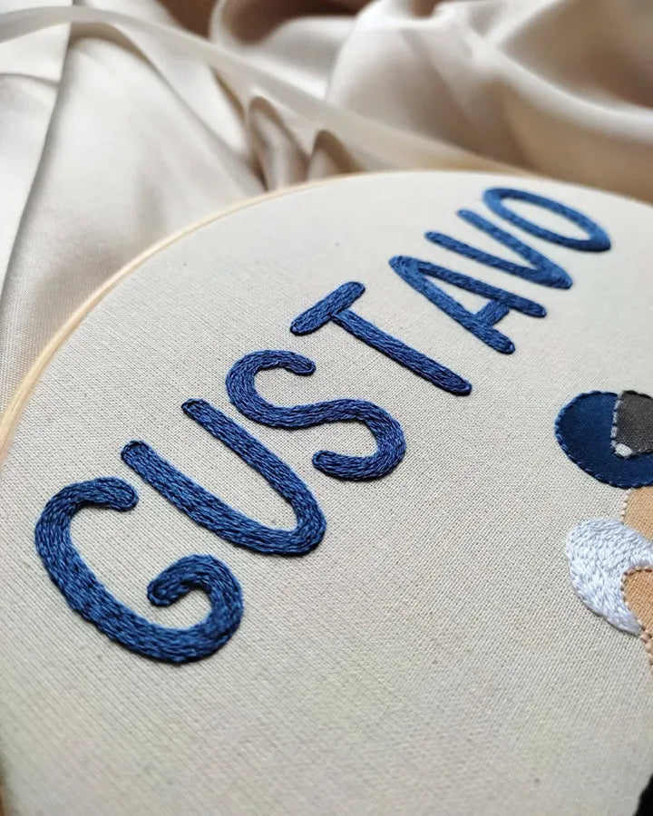 Custom motorbike clock showing detailed baby rider embroidery work