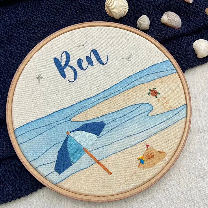 Embroidery hoop with a beach scene