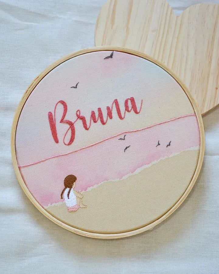 Embroidery hoop with a beach scene design