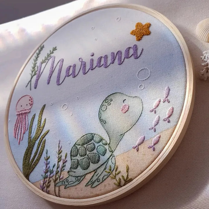 Embroidery hoop with a turtle design