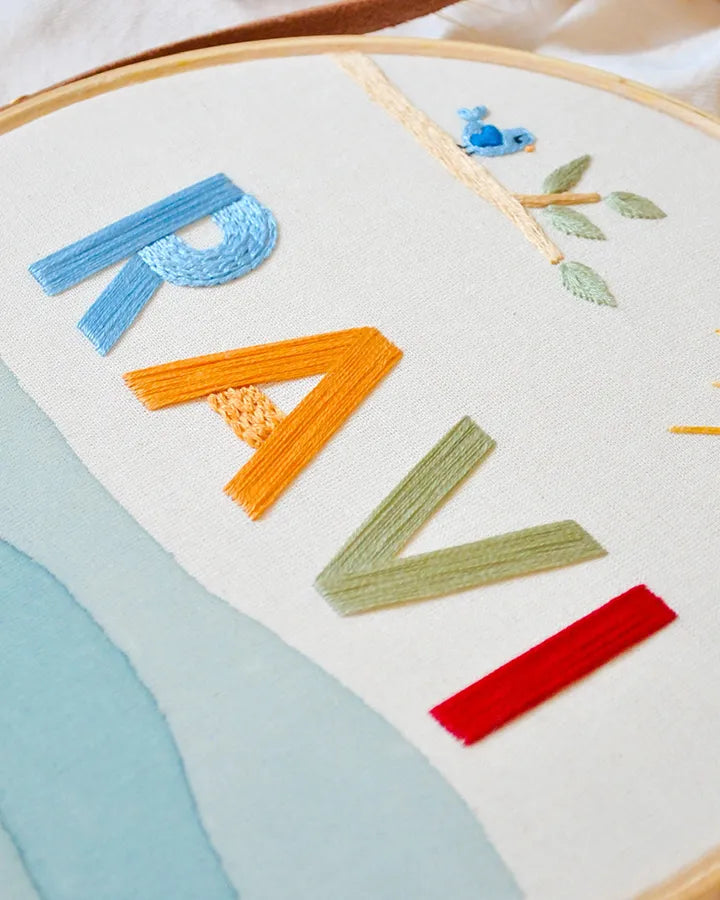 Embroidery hoop with colorful letters