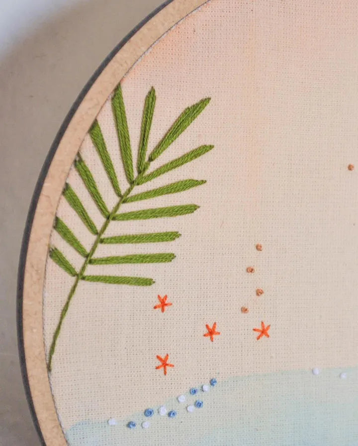 Embroidery hoop with green leaf