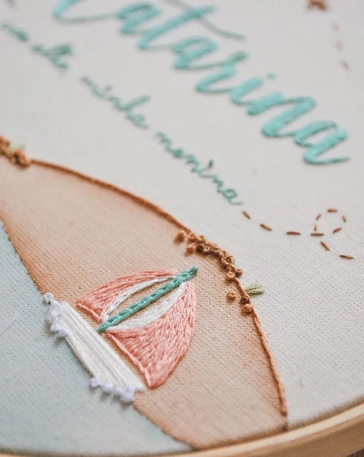 Embroidery hoop with sailboat design