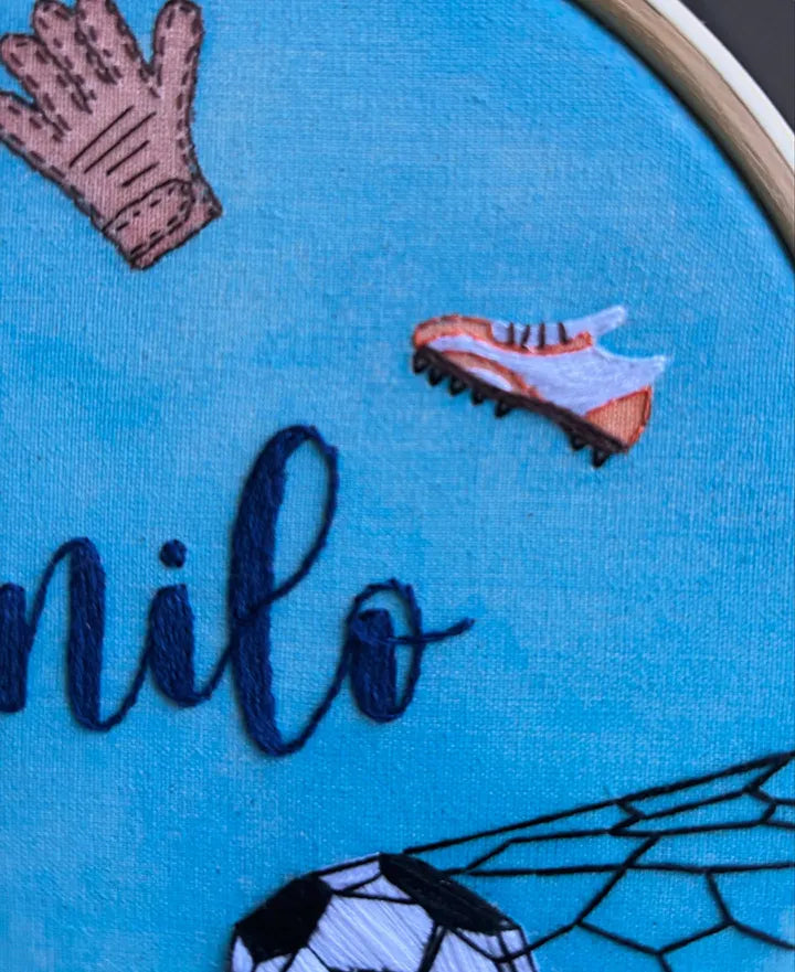 Personalized baby gifts boy featuring hand-embroidered sports player action design