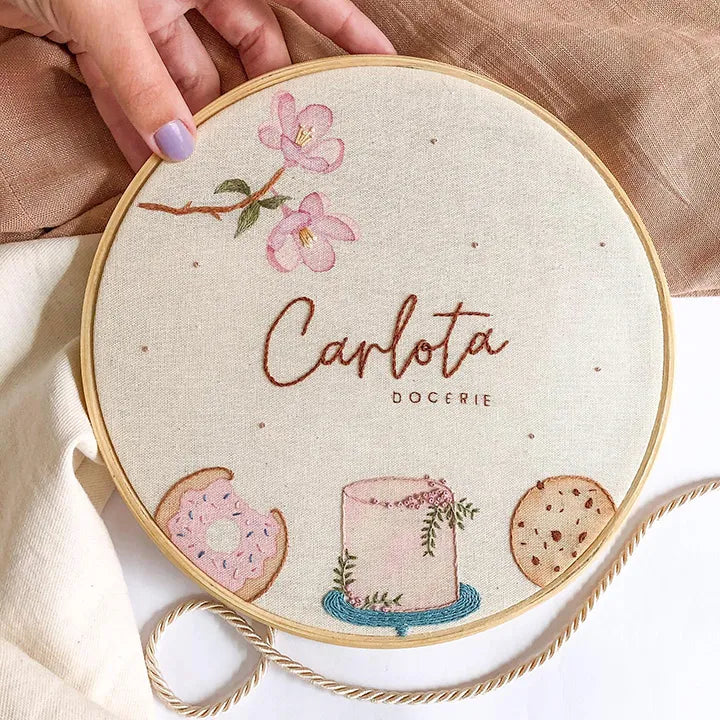 Personalized kitchen clocks showing detailed bakery-themed embroidery work