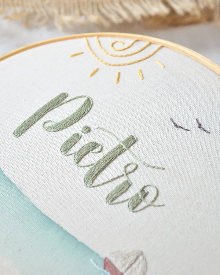 name embroidery on beach-themed hoop