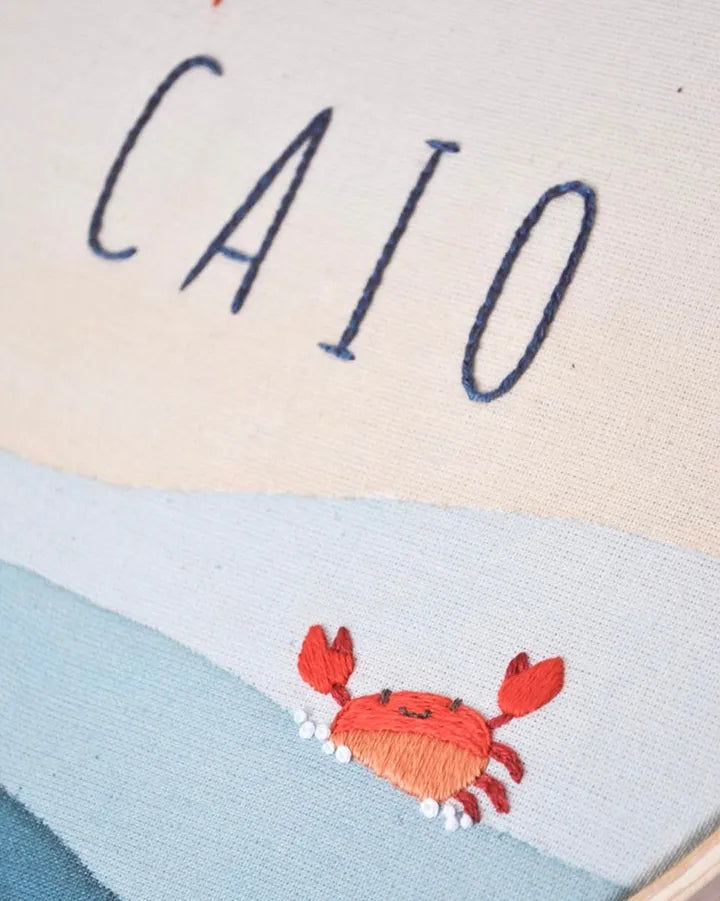 red crab and name embroidery by hand